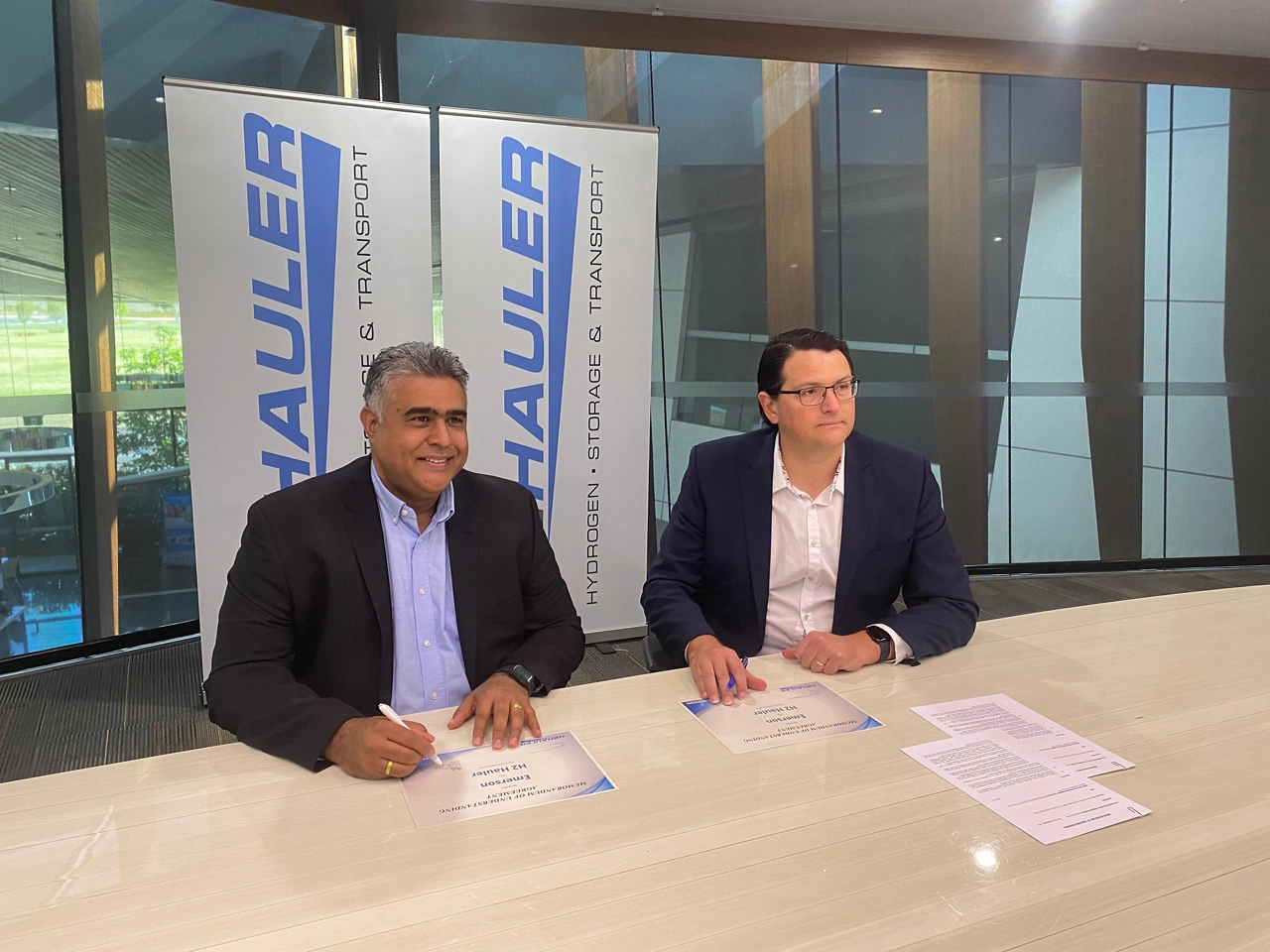 Emerson’s Mike Train and H2 Hauler’s Tyson Cooney sign collaboration agreement.