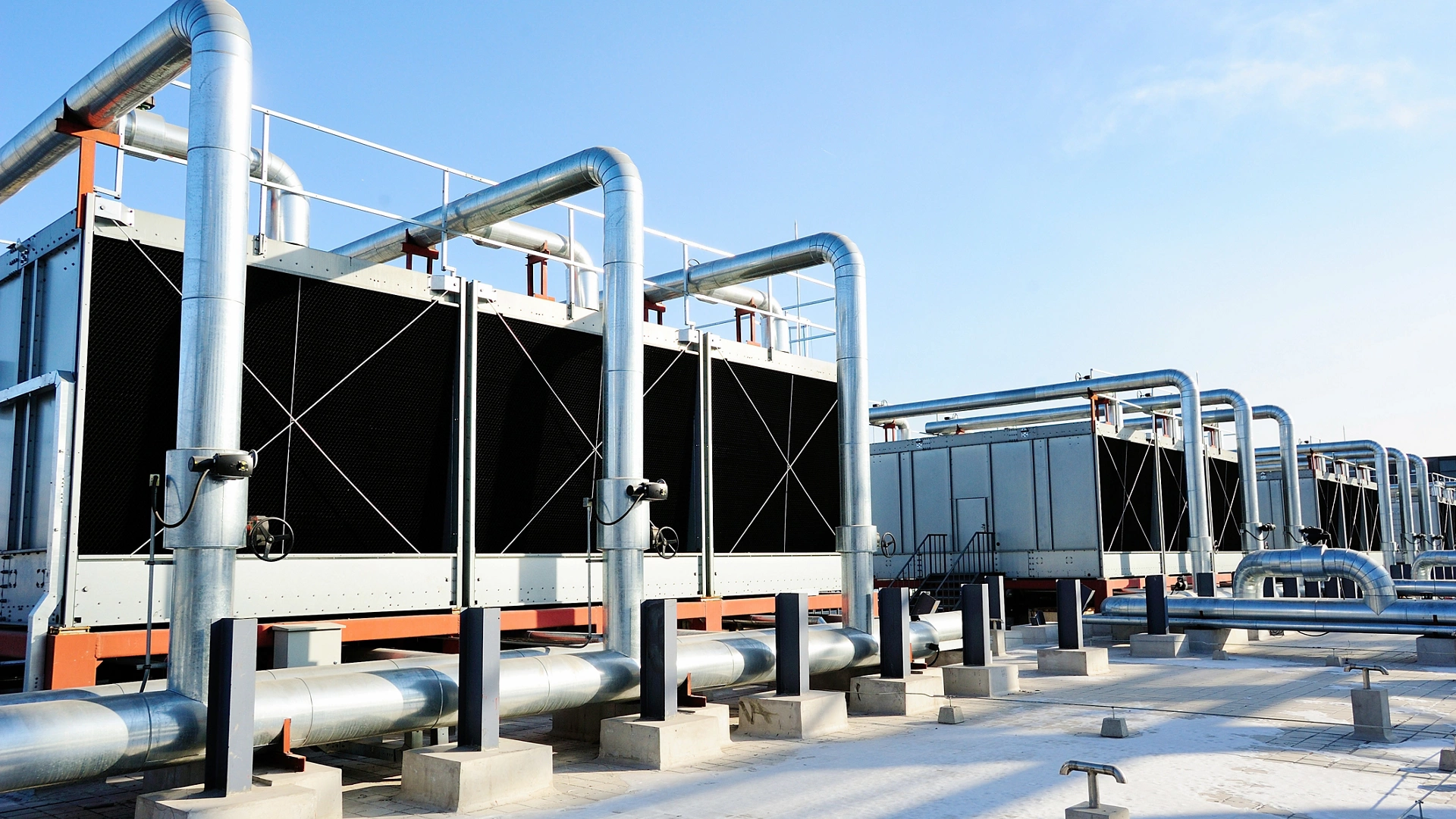 Sets of cooling towers in data center building.