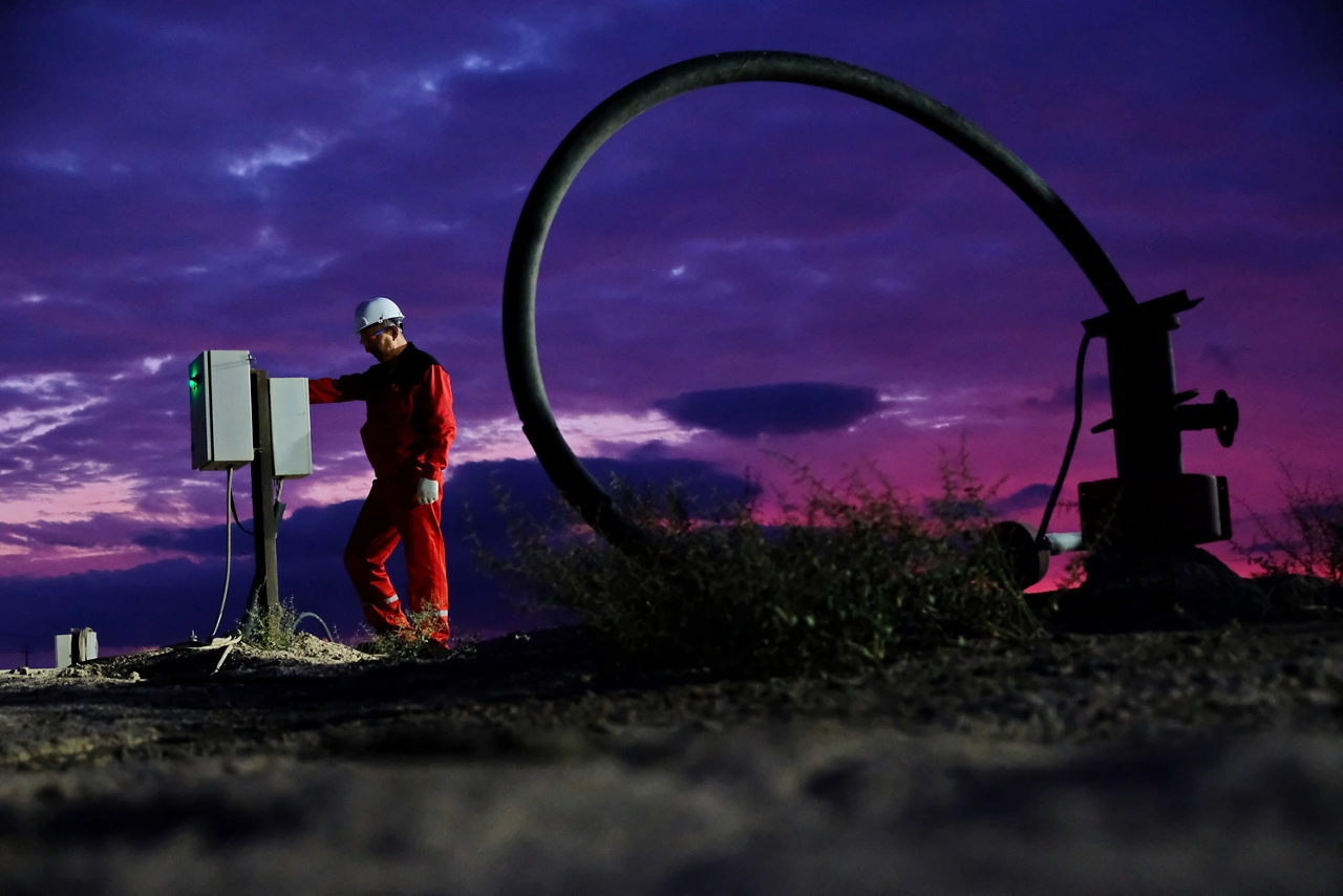 Kyzylorda region, Kazakhstan - 09.14.2019 : A worker monitors the indicators next to the uranium mining plant at the mine at night.