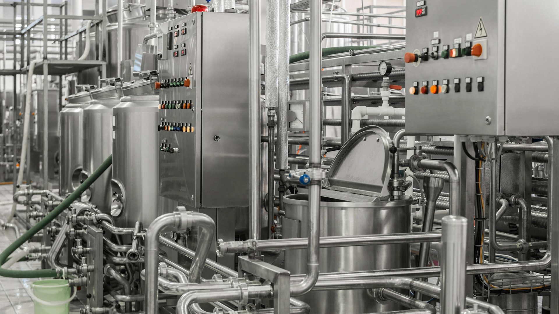 electronic control panel and tank at a milk factory. equipment at the dairy plant