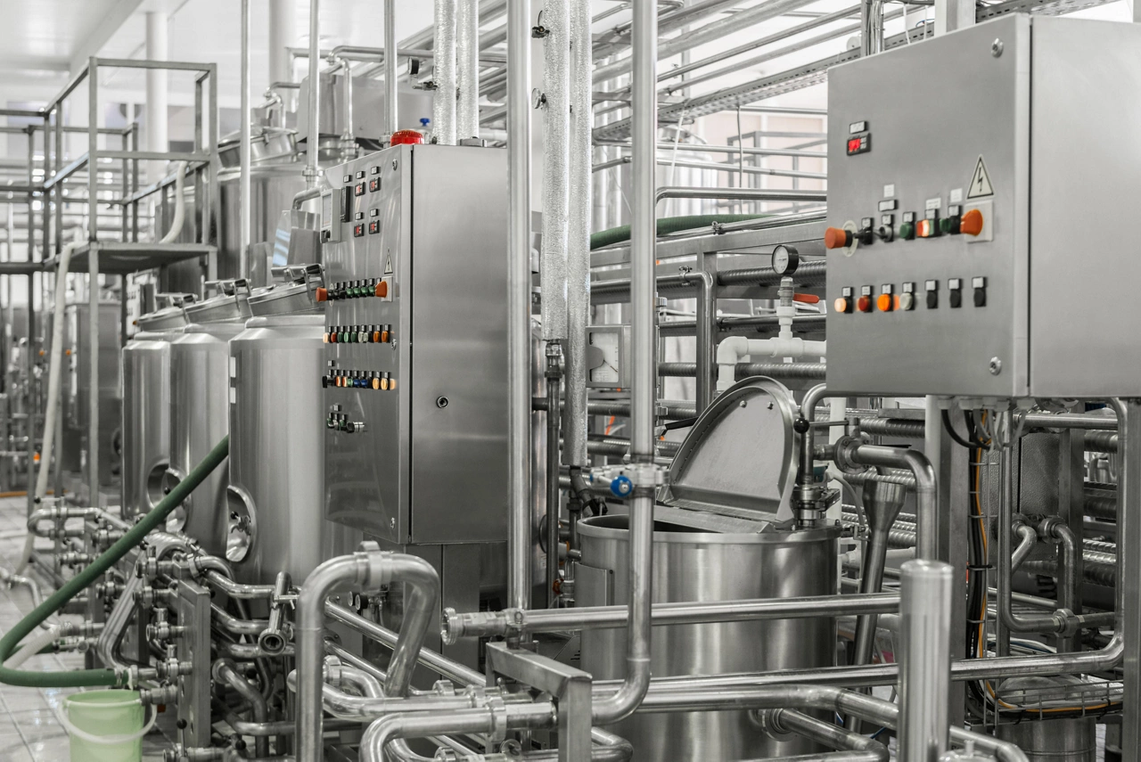 electronic control panel and tank at a milk factory. equipment at the dairy plant