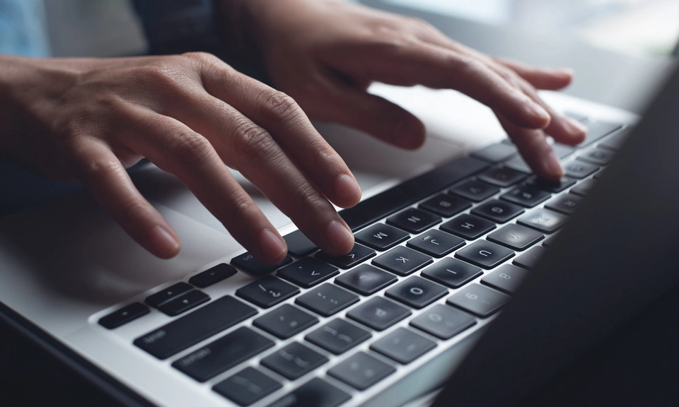Close up of business woman hands typing on laptop computer 