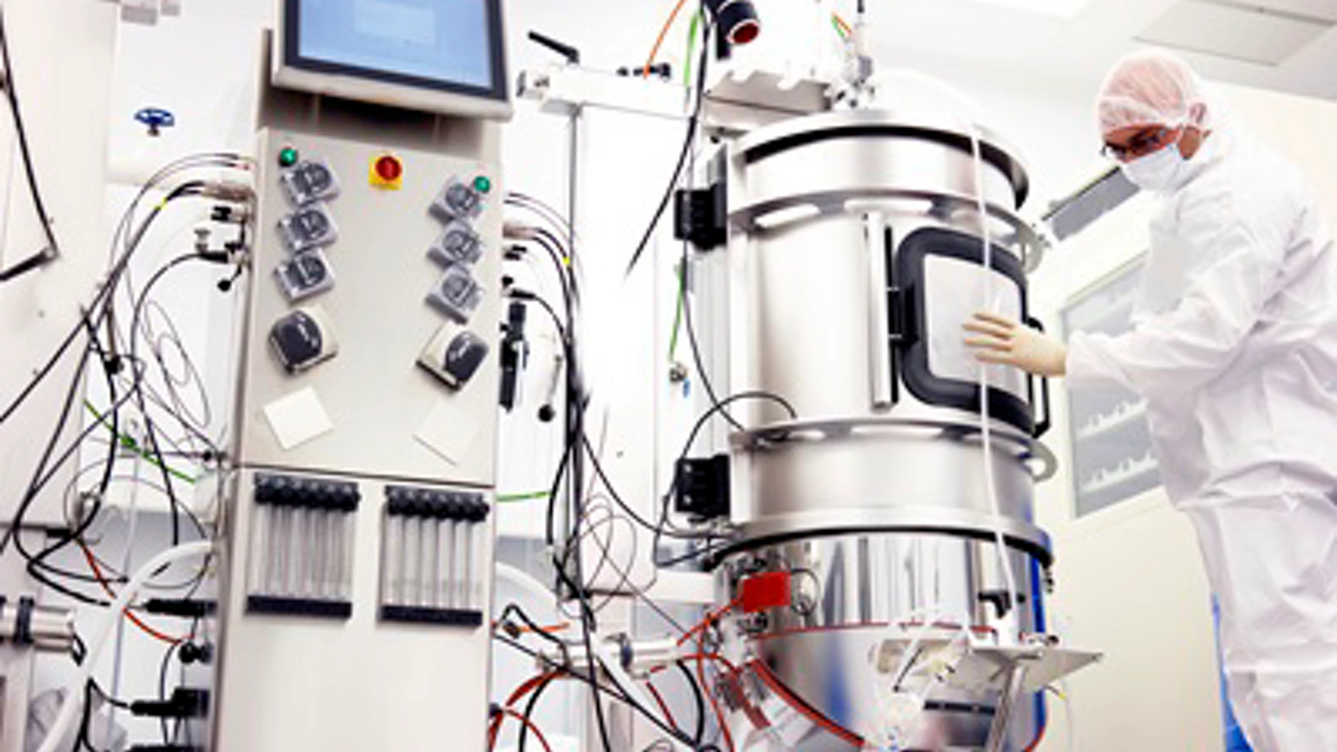 Scientist working with a bioreactor for cell culture