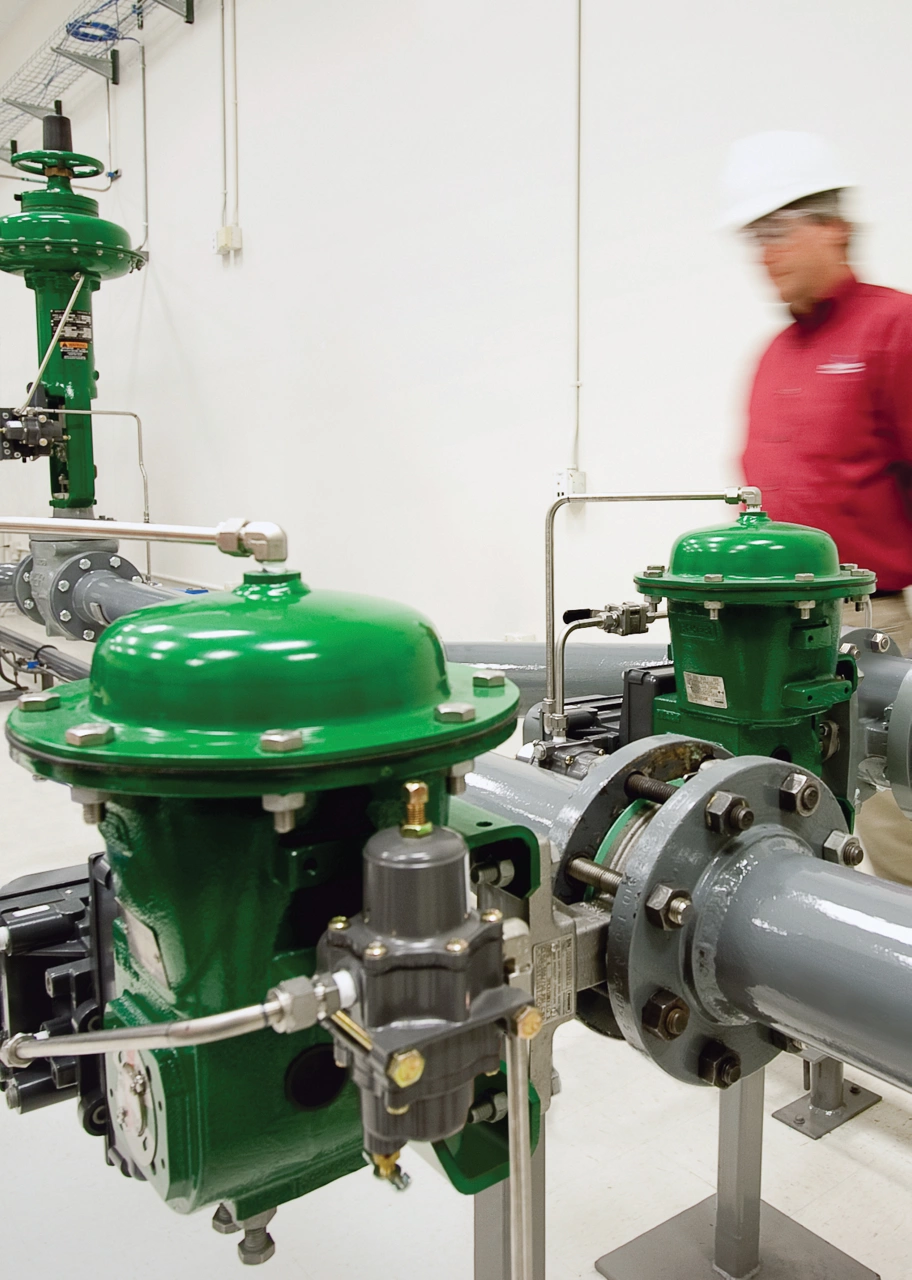 Engineer with Fisher valves in test lab