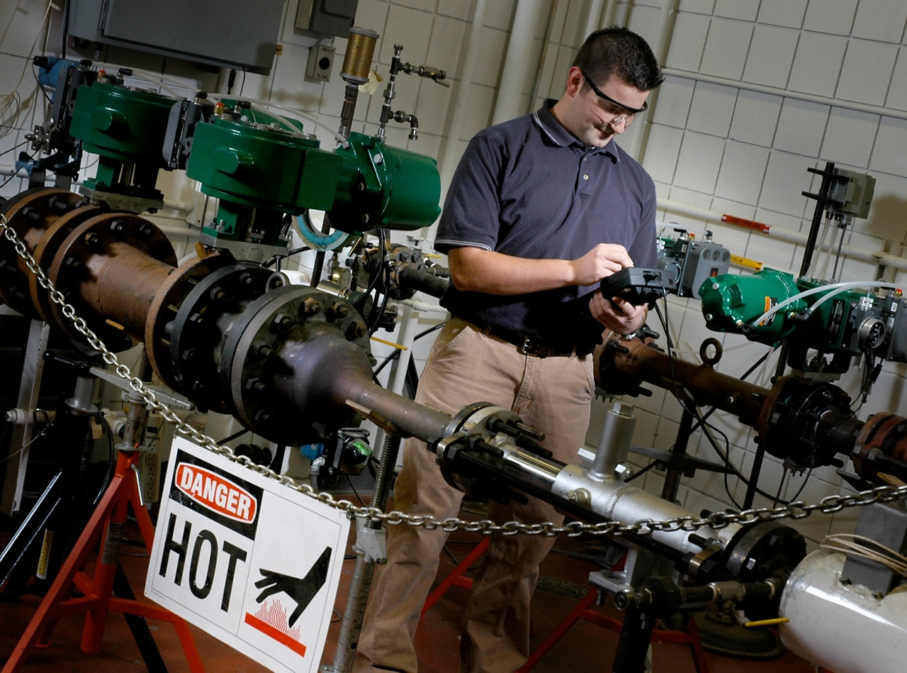 Male engineer testing Fisher rotary valves in hot air system