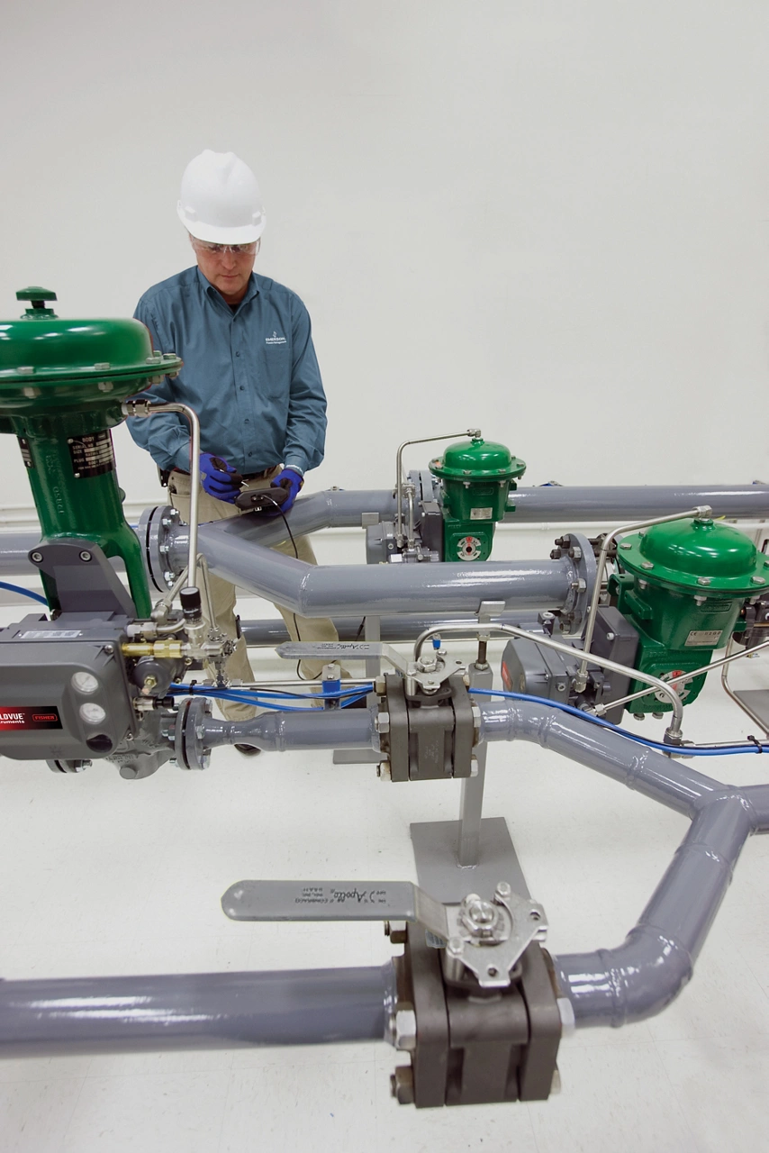 Engineer with Fisher valves in lab