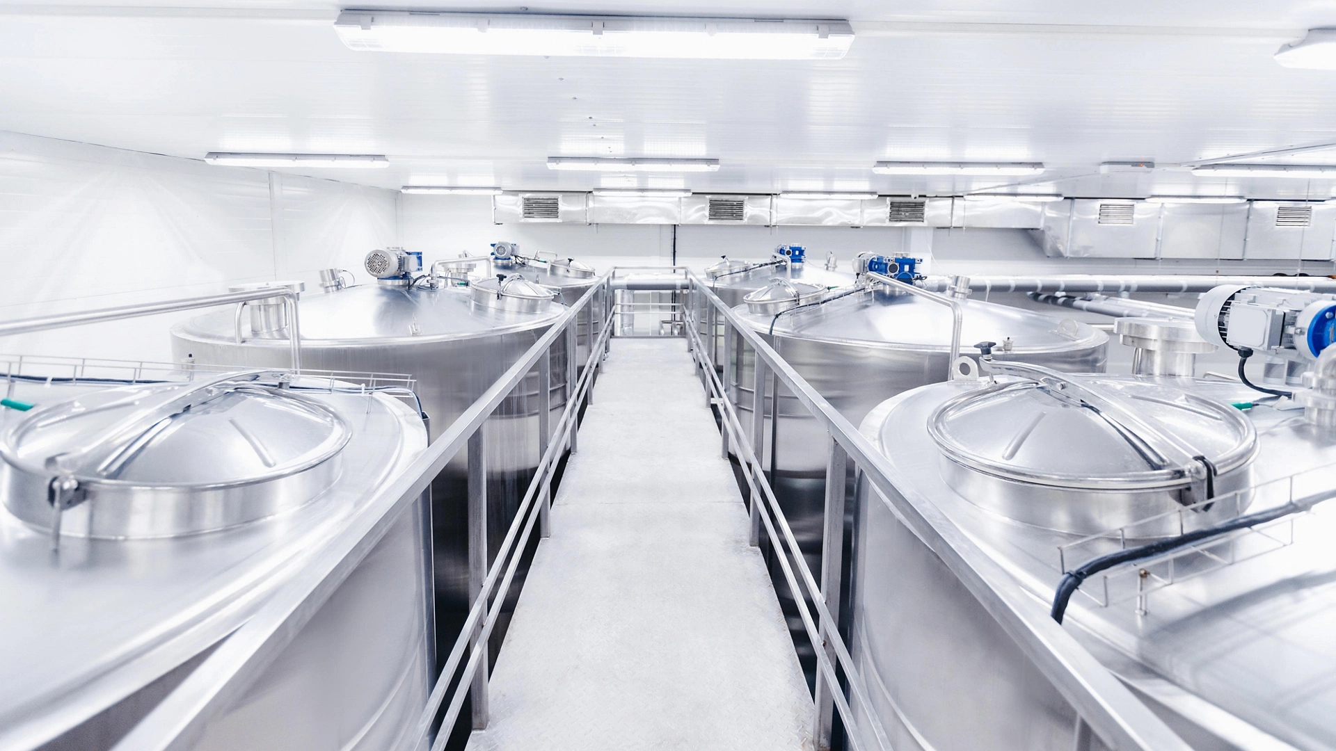 Equipment dairy plant, milk factory industry. Stainless steel storage and processing tanks.