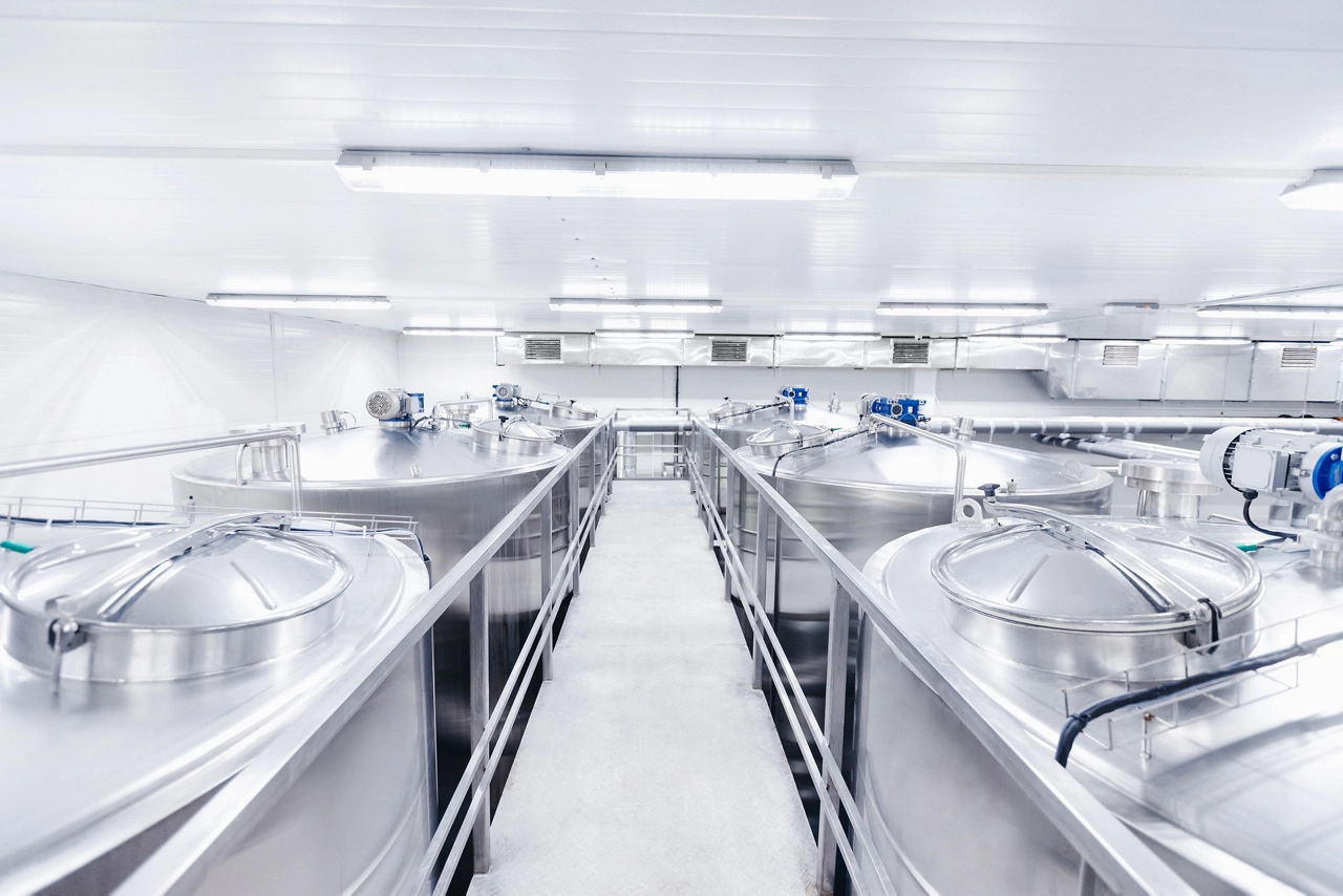 Equipment dairy plant, milk factory industry. Stainless steel storage and processing tanks.